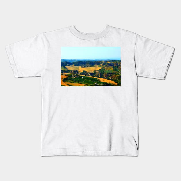 Rural view in Acquaviva Picena with rugged Marche landscape, meadows, ravines and scattered houses Kids T-Shirt by KristinaDrozd